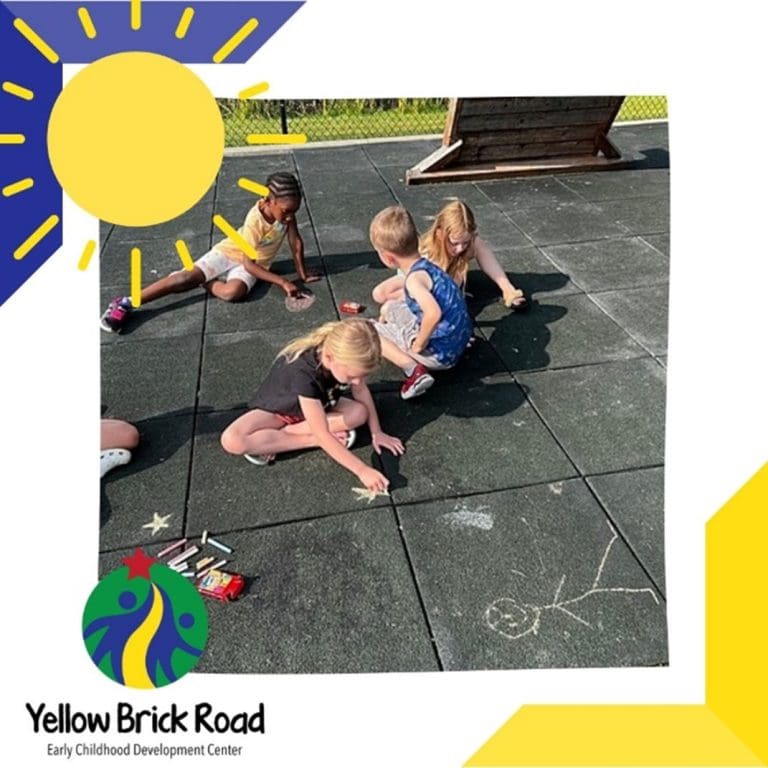 preschoolers writing with chalk