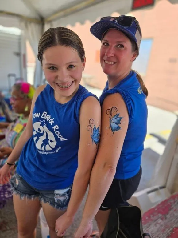 parents and child with matching tatoo at preschool