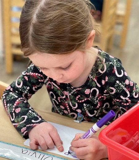preschool girl writing